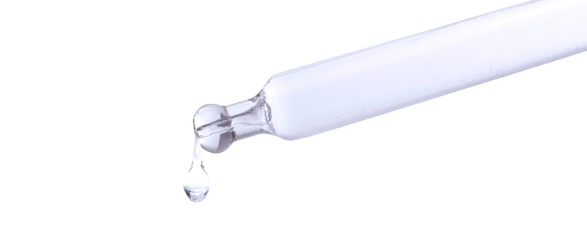 glass dropper with clear liquid